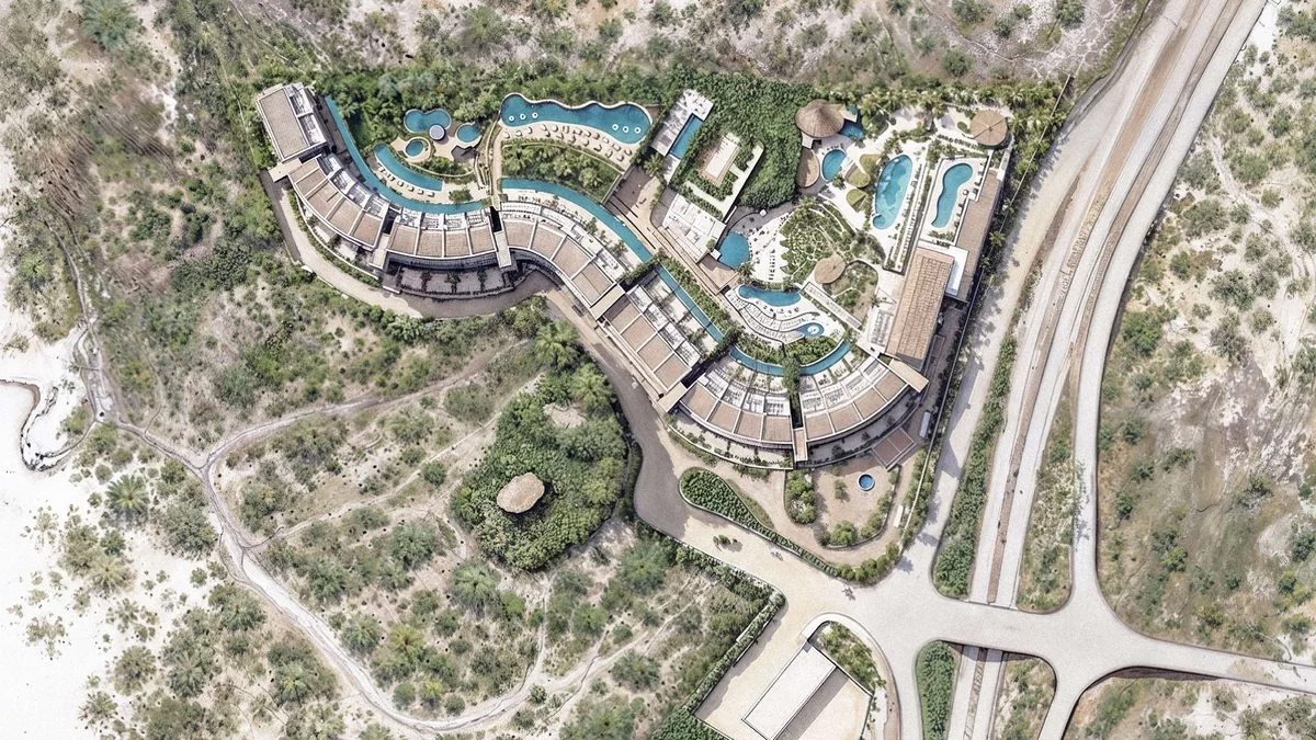 Illustrated DUNNA masterplan (brochure p.21): residences, the Live Aqua hotel, lagoons, pools and amenities