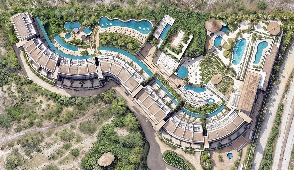 Illustrated DUNNA masterplan (brochure p.21): residences, the Live Aqua hotel, lagoons, pools and amenities
